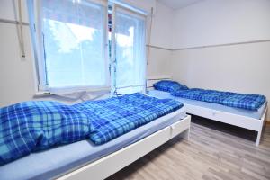Ein Bett oder Betten in einem Zimmer der Unterkunft Apartment Köln Porz