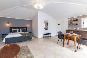A bed or beds in a room at Villa Victoria With Heated Pool