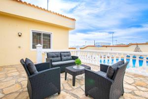 A balcony or terrace at Villa Victoria With Heated Pool