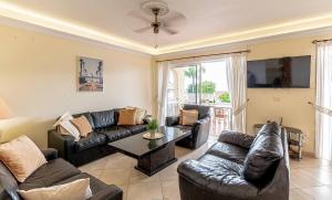 A seating area at Villa Victoria With Heated Pool