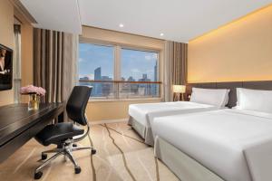 Letto o letti in una camera di Ascott Huai Hai Road Shanghai, Xintiandi