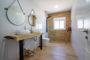 a bathroom with a sink and a mirror at Villa RUBI in Nerja +21 photos