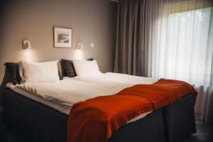 Voodi või voodid majutusasutuse Ädelfors Hotell & Konferens toas