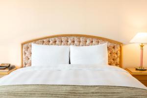 Postel nebo postele na pokoji v ubytování Lotte Hotel Busan