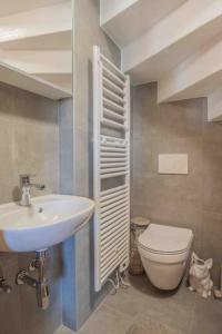 a bathroom with a sink and a toilet at Chalet avec vue in Nendaz