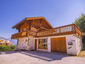 a small house with a balcony on top of it at Chalet avec vue in Nendaz