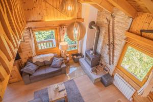 an overhead view of a living room with a fireplace at Chalet avec vue in Nendaz