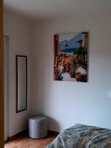 a bedroom with a picture hanging on the wall at Lena in Meljine