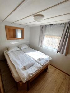 Postel nebo postele na pokoji v ubytování Domek Oskar