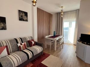 TV a/nebo společenská místnost v ubytování Blue Moon Penthouse