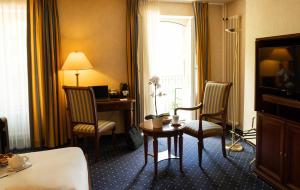 Televiisor ja/või meelelahutuskeskus majutusasutuses Grand Hotel et Centre Thermal d'Yverdon-les-Bains