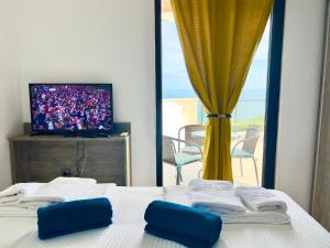 Et tv og/eller underholdning på The White Pearl Boutique Villa