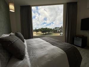 Uma cama ou camas num quarto em 墾丁卿卿文旅