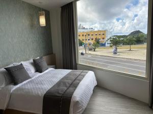 Uma cama ou camas num quarto em 墾丁卿卿文旅