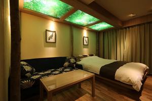 Postel nebo postele na pokoji v ubytování HOTELox大人用