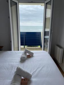 Katil atau katil-katil dalam bilik di Appartement la Chaume vue côte sauvage
