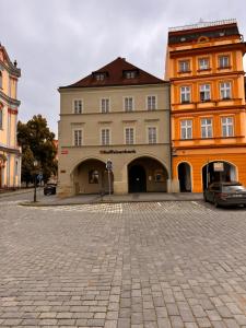 a large building with a car parked in front of it at U Zlaté hvězdy, Karel IV in Litoměřice