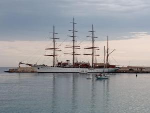 a large sail boat sitting in the water at Dimora Lilium in Otranto
