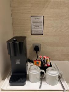 D'Hotel Singapore managed by The Ascott Limited的咖啡和沏茶工具