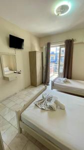 Postel nebo postele na pokoji v ubytování Velonis Apartments