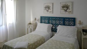 Postel nebo postele na pokoji v ubytování Hotel Lido Garda + 37 fotografií