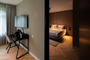 Postel nebo postele na pokoji v ubytování Veluwe Hotel De Beyaerd