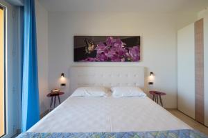 A bed or beds in a room at Il Giardino Sul Mare