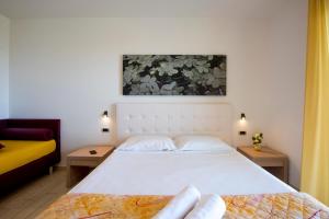 A bed or beds in a room at Il Giardino Sul Mare