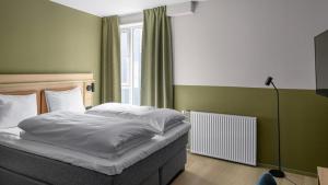 Postel nebo postele na pokoji v ubytování Comfort Hotel Trondheim