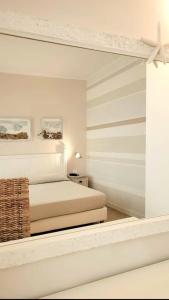 Postel nebo postele na pokoji v ubytování Hotel Acquamarina