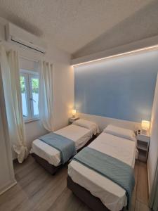 Ένα ή περισσότερα κρεβάτια σε δωμάτιο στο Soleil 24