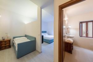 Postel nebo postele na pokoji v ubytování Albergo Diffuso Borgo La Terra