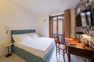 Postel nebo postele na pokoji v ubytování Albergo Diffuso Borgo La Terra