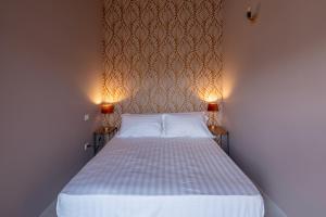 Postel nebo postele na pokoji v ubytování Albergo Diffuso Borgo La Terra