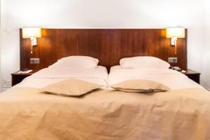 Voodi või voodid majutusasutuse J5 Hotels Helvetie & La Brasserie toas
