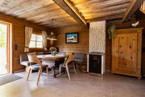 a dining room with a table and chairs at Chalet Haarberg in Golling an der Salzach