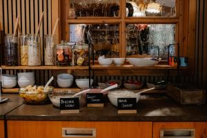 a counter with bowls of food on a table at Landhotel Gary in Wolframs-Eschenbach