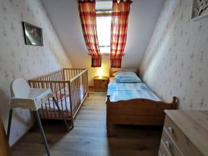 Postel nebo postele na pokoji v ubytování FHKlützke Deichblick