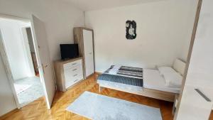 Postel nebo postele na pokoji v ubytování Apartman Perun - Niksic