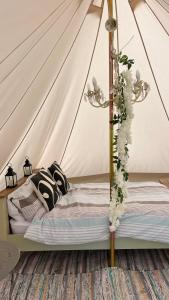 a bedroom with a bed in a tent at Spenford House 1640 listed house Idilic Location pub walking distance in Shrewsbury