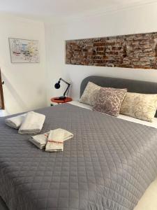 Postel nebo postele na pokoji v ubytování Loft La Città Vecchia