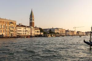 a view of a river with buildings and a boat at The St. Regis Venice in Venice