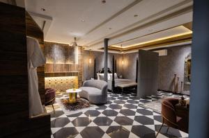 a lobby with a room with a couch and a bed at Dream Connect Boutique House in Jodhpur +24 photos