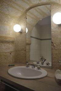 a bathroom with a sink and a mirror at Maison Lambert in Domme +34 photos