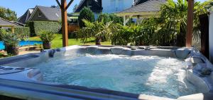 a large hot tub in a backyard with at Fewo Traum in Neppermin