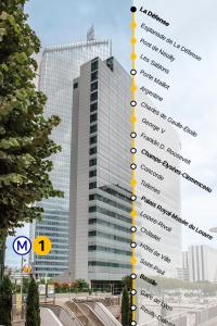 a tall building with the names of its buildings at Melia Paris La Defense in Courbevoie