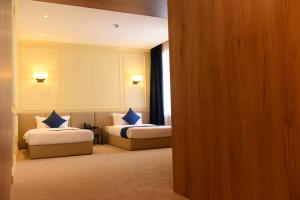Ulaanbaatar Hotel客房内的一张或多张床位