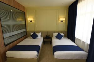 Ulaanbaatar Hotel客房内的一张或多张床位