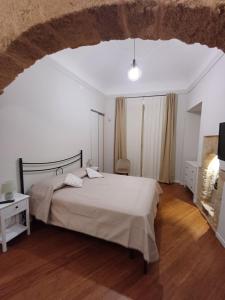 a bedroom with a large bed in a room at Residenza del Massimo in Palermo