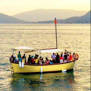 a group of people on a boat in the water at Jadranka Boat in Tivat